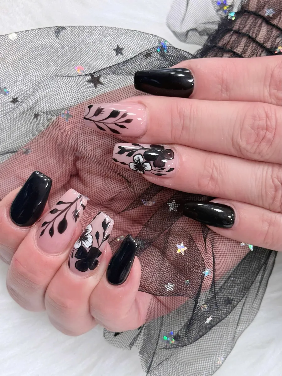 Black and nude coffin nails with botanical line art by V Nails Lacombe