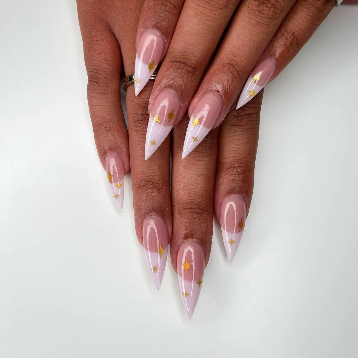 Sheer pink stiletto French nails with miniature florals by V Nails Lacombe