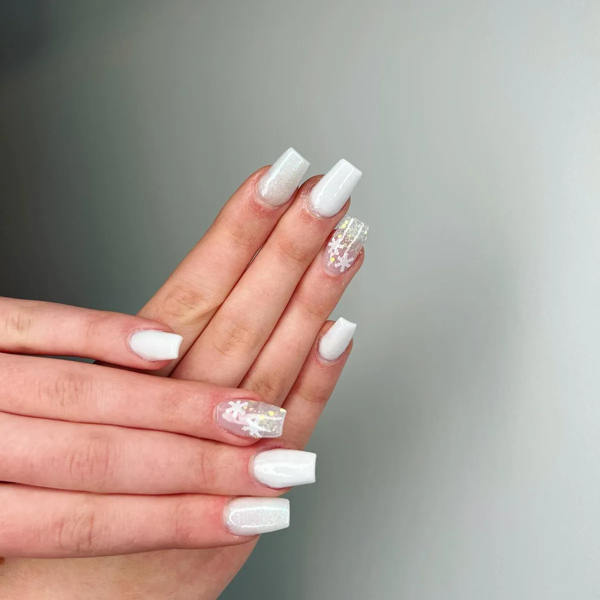 Glossy white nails with pink glitter accents by V Nails Lacombe